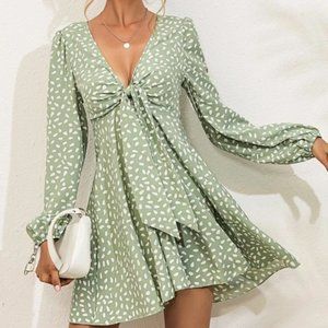 Green and white patterned dress